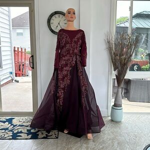 It’s a burgundy dress with over skirt, sequins size 14 but it was altered